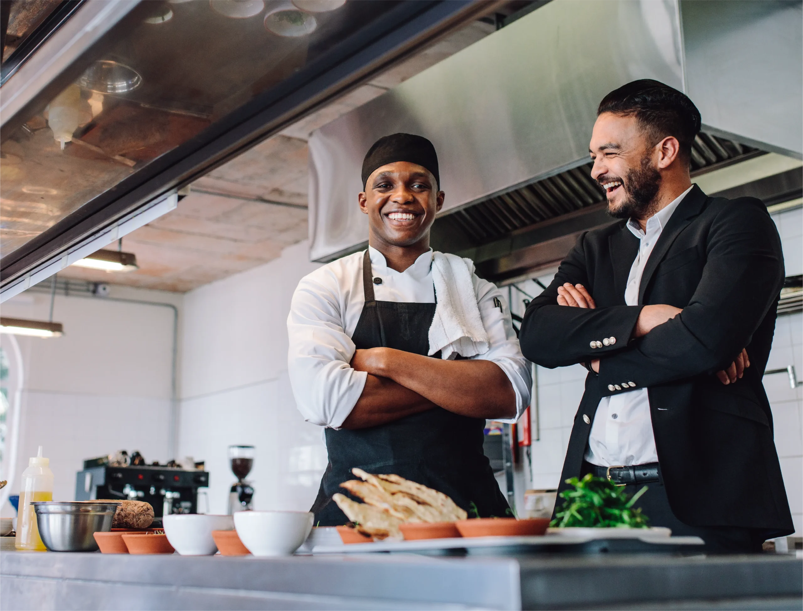 chef and manager in restaurant kitchen