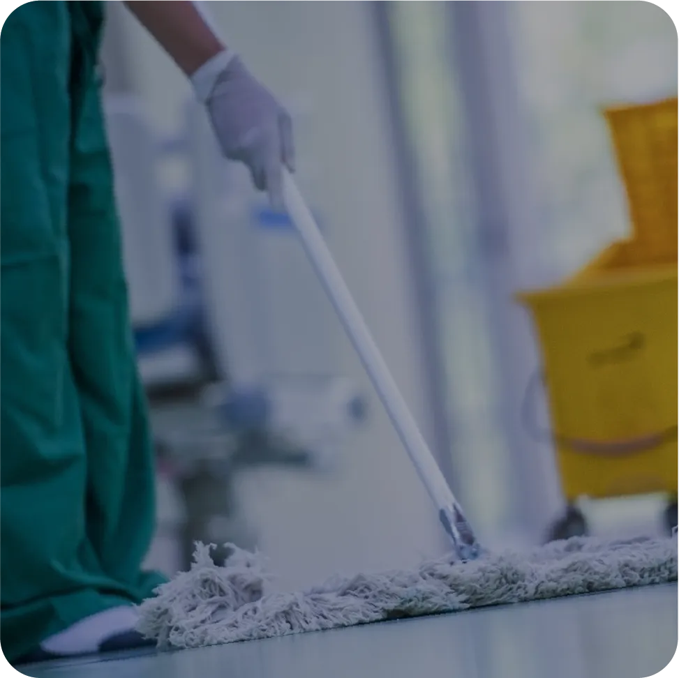 Person using a mop in a hospital